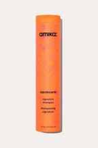 Amika Normcore Signature Shampoo bottle, a gentle Color Safe Shampoo designed for all hair types.