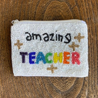 Made you smile! These bedazzled beaded change purses are just what that sassy gal in your world needs to take it up a notch!  Details:  5" x 3.5" Zippered top
