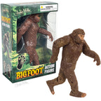 The Bigfoot Action Figure, an articulated vinyl toy inspired by the legendary Patterson film, is posed in front of its colorful, forest-themed box packaging.
