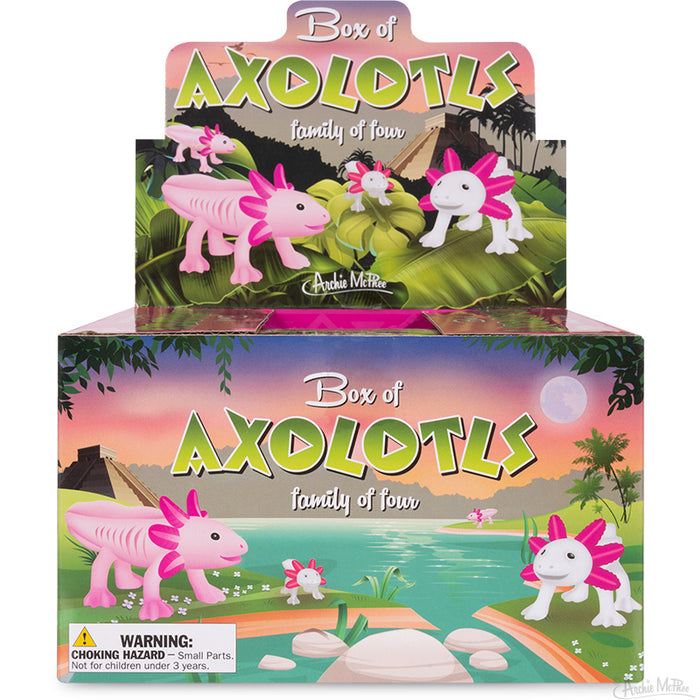 The Box of Axolotls, featuring a delightful axolotl family crafted from soft vinyl, is attractively set against a tropical scene adorned with trees and a breathtaking sunset sky.