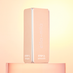 Peach nail buffer block standing upright on a peach background