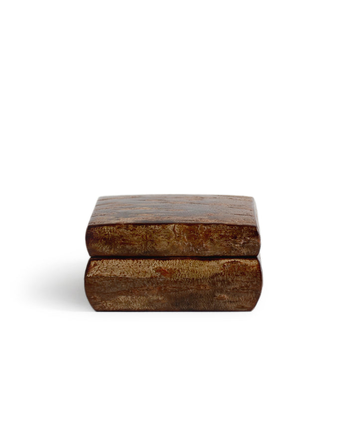 Wooden box with a textured surface by Denshiro on a white background