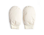 Pair of cream-colored hand warmer mittens by Iwata on a white background