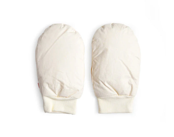 Pair of cream-colored hand warmer mittens by Iwata on a white background