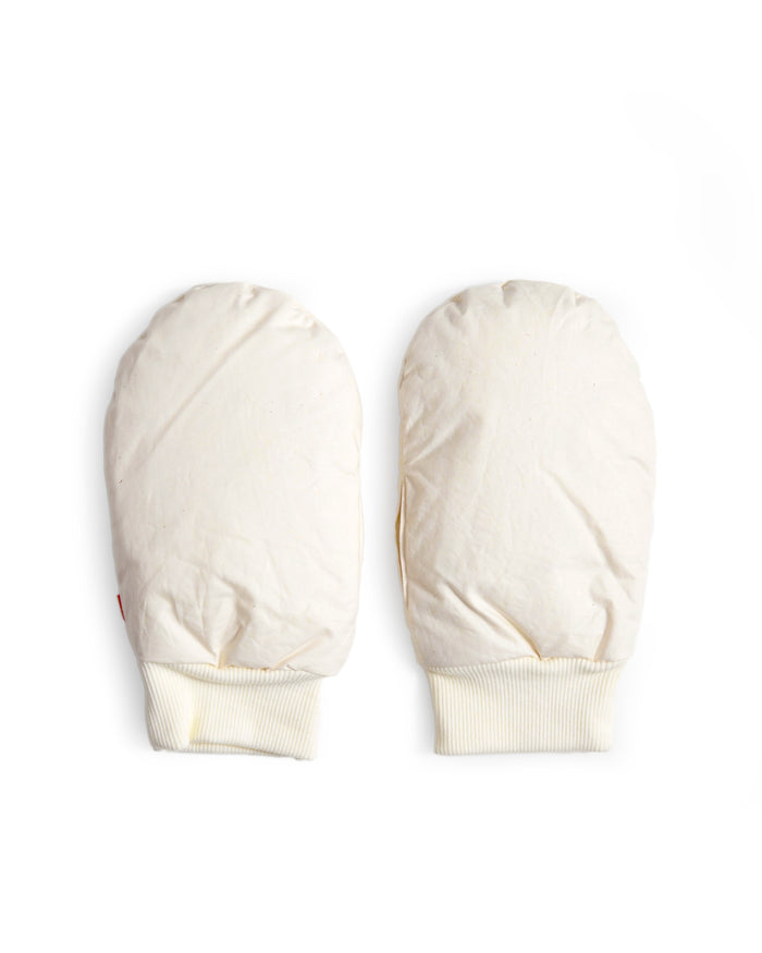 Pair of cream-colored hand warmer mittens in size small by Iwata on a white background