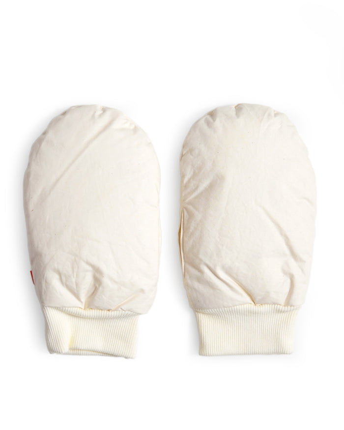 Pair of cream-colored hand warmer mittens in size medium by Iwata on a white background