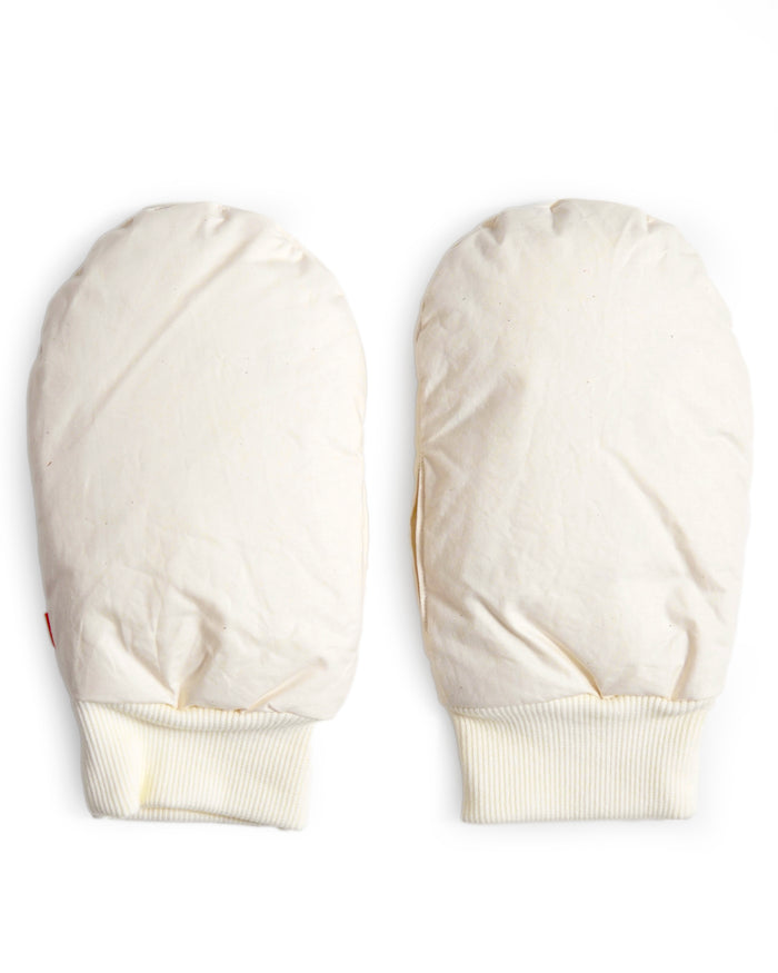 Pair of cream-colored baby hand warmers in size large by Iwata on a white background