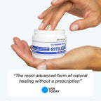 hands holding emu aid ointment toggler