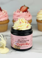 Buttercream frosted cupcake body scrub and soap jar with pink frosted cupcakes in background