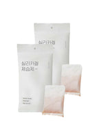 Three white packages with Korean text on a white background