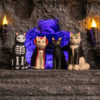 The *Goth Cats* are featured in Halloween costumes, including a skeleton, vampire, bat, and emo set against a backdrop of eerie glowing lights.