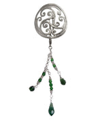 Silver scrollwork hair hook with dangling green bead charms, front view