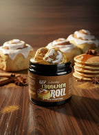 Iced cinnamon roll body scrub and soap jar with frosted rolls, pancakes, and spices on wood table