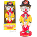 The J.P. Patches Nodder, inspired by the beloved Seattle children's TV show, showcases a yellow coat and colorful clothes, with its packaging box beside it.