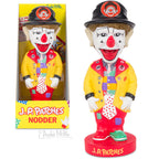 The J.P. Patches Nodder, inspired by the beloved Seattle children's TV show, showcases a yellow coat and colorful clothes, with its packaging box beside it.