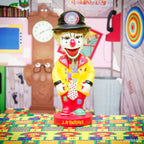 The J.P. Patches Nodder, a clown figurine featuring a red nose, yellow coat, and polka dot tie, stands in a vibrant, playful room inspired by the cherished Seattle TV show J.P. Patches.
