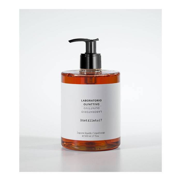 Liquid soap bottle with pump on a white background