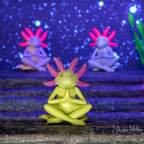 Three Meditating Axolotls sit cross-legged on a stone surface against a starry backdrop, embodying a sense of mindfulness.