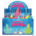 Box of vibrant Meditating Squid figures with oceanic-themed packaging, ideal for meditation enthusiasts.