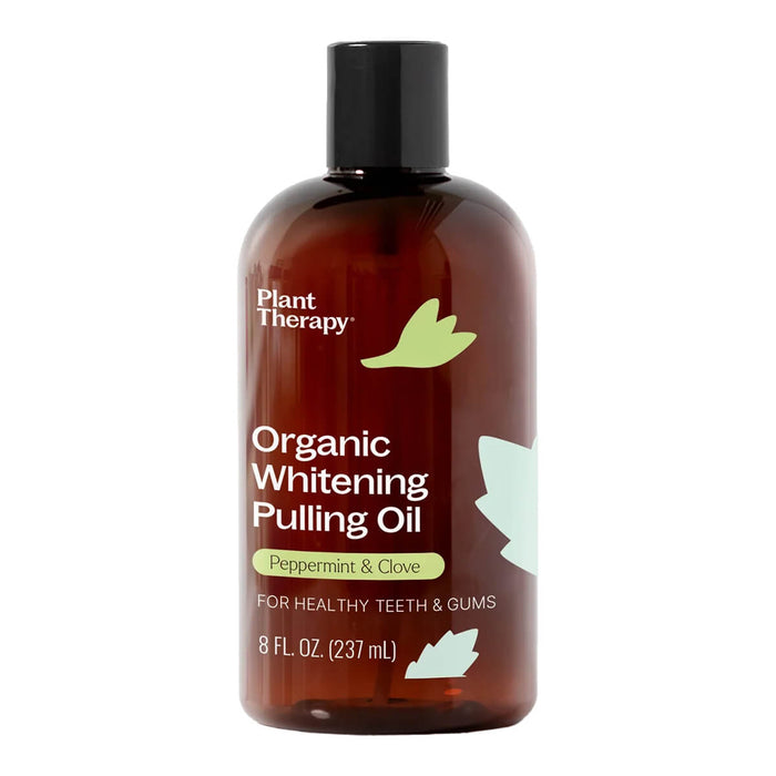 Small bottle of organic whitening pulling oil with peppermint and clove.