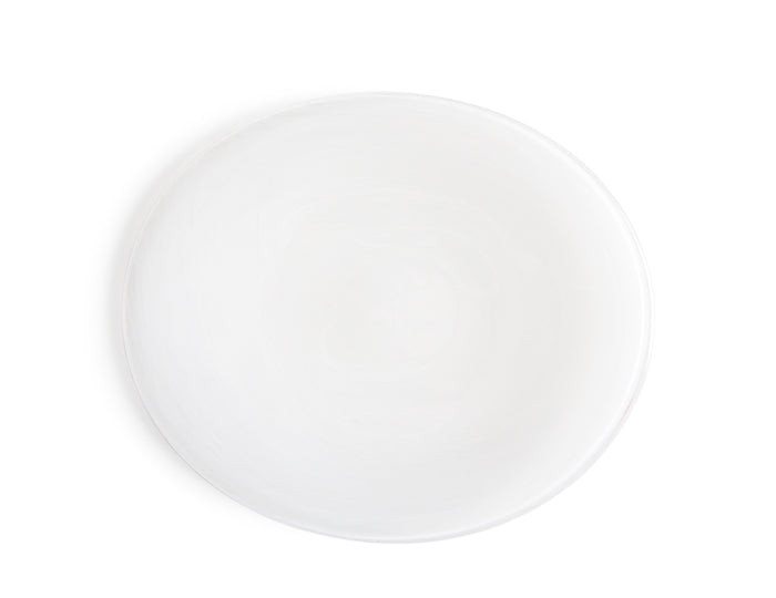 Silhouetted image of the brush oval plate by factory zoomer against white background.