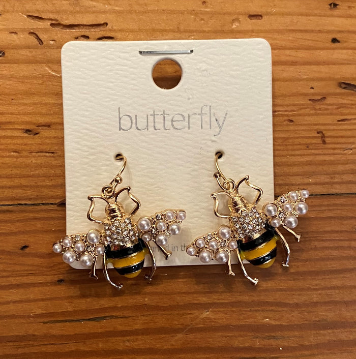 Feel the buzz of these eye-catching Pearled Bee Earrings, featuring a classic a black and gold striped design with delicate wire earrings and shimmering pearls. Crafted with gold hardware for an elegant and timeless look. These are also perfect for those GA Tech fans!