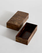 Open wooden small box with lid by Denshiro on a light gray background