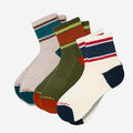 Set of four pairs of colorful socks with striped patterns on a white background