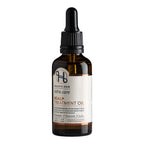 Scalp treatment oil in a 50 ml bottle with dropper.