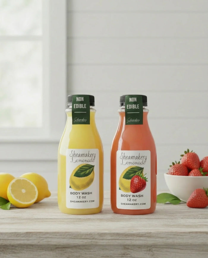 Strawberry and lemon body wash bottles on table with fresh lemons and strawberries.