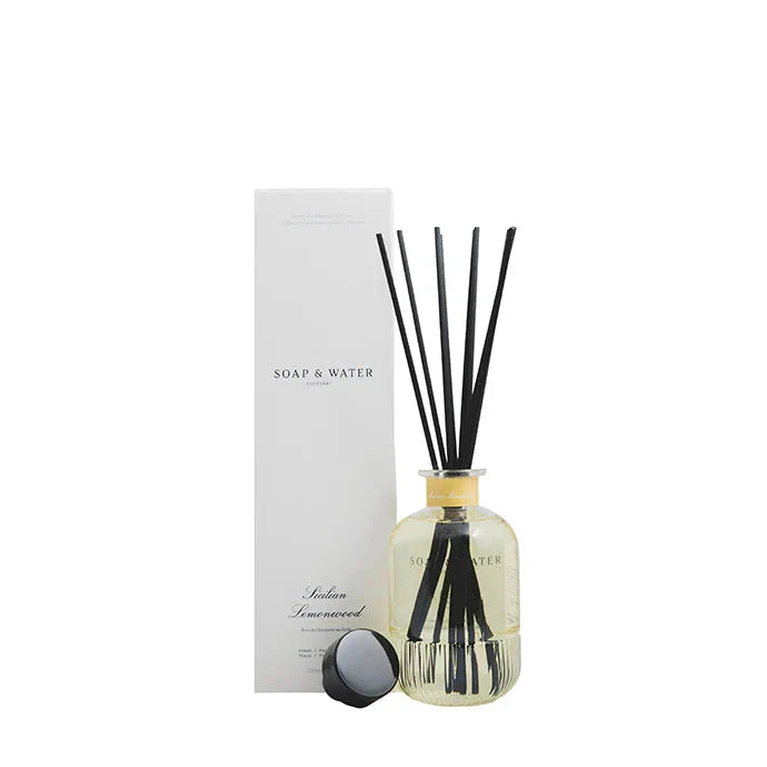 Diffuser bottle with black sticks and a box labeled 'Soap & Water' on a white background